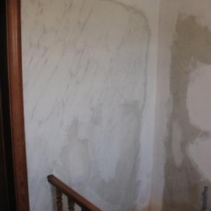 Reparation à l'enduit + nettoyage des surfaces.